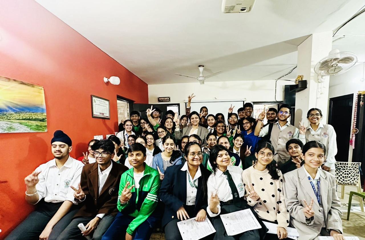 RAC students with Mrs. Nupur Gupta celebrating results